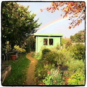 Print shed touched by an autumnal rainbow